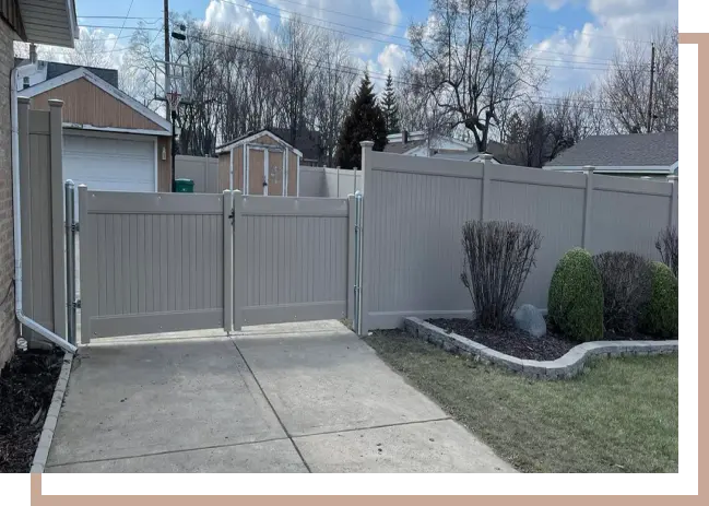 a vinyl fence attached to a gate
