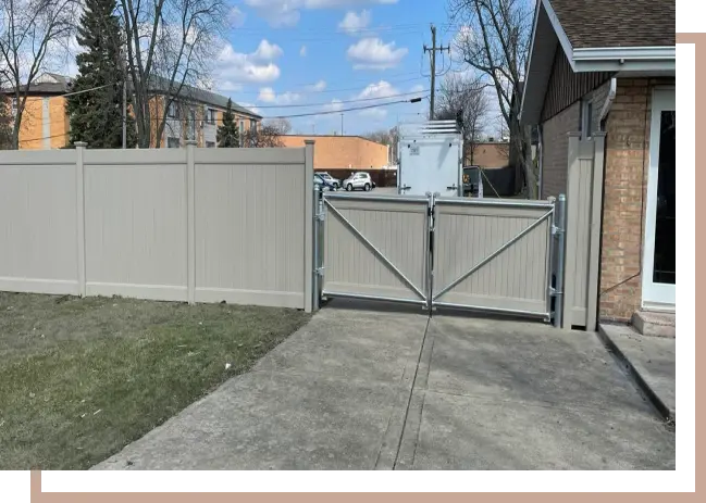a vinyl fence with a gate
