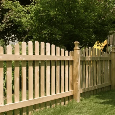 spaced wood fence with trees in a background