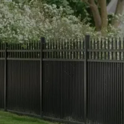 a tall black aluminum fence