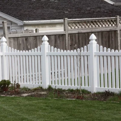 white vinyl fence wrapped around yard